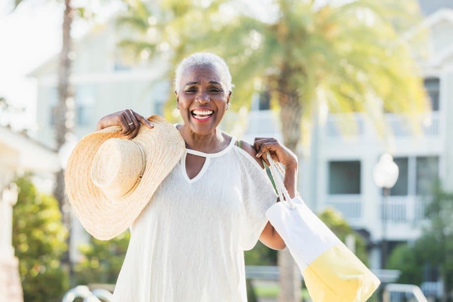 woman smiling outside in the sun