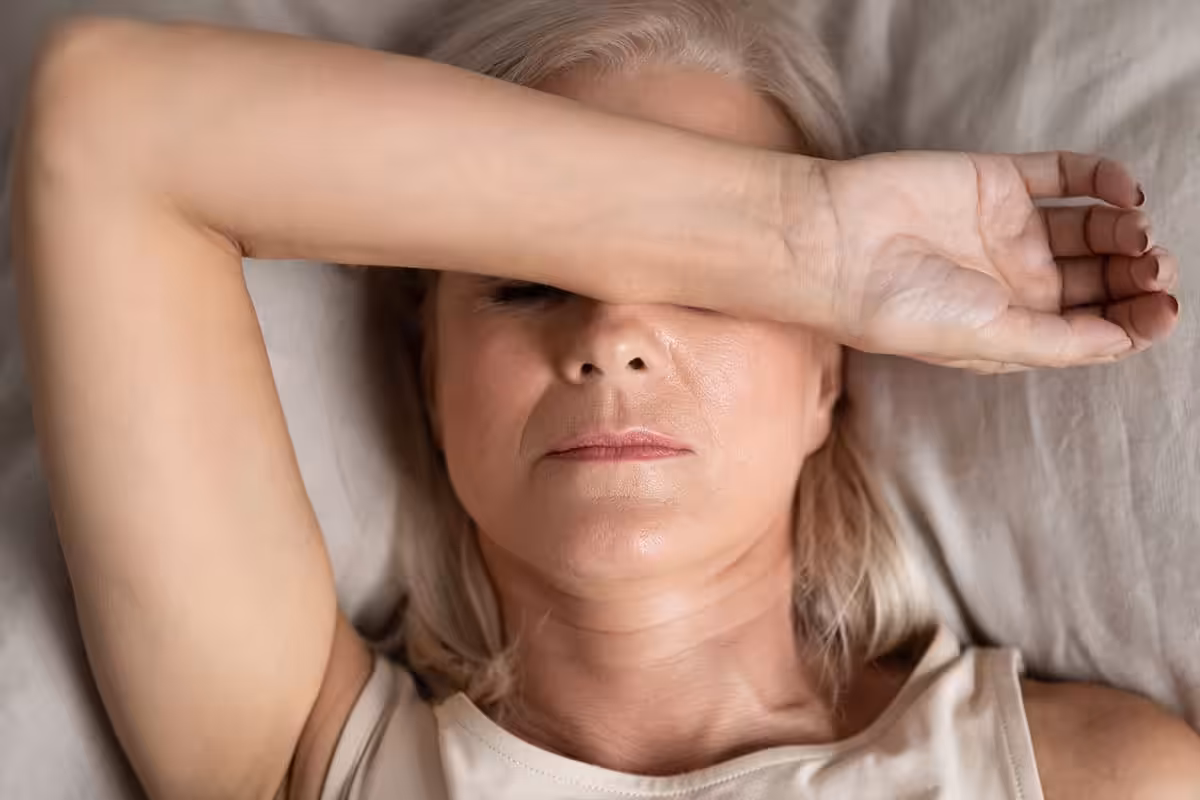 Woman Tired Lying In Bed Sleep Apnea.jpg